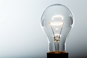 illuminated lightbulb indicating ideas to advance career during downturn